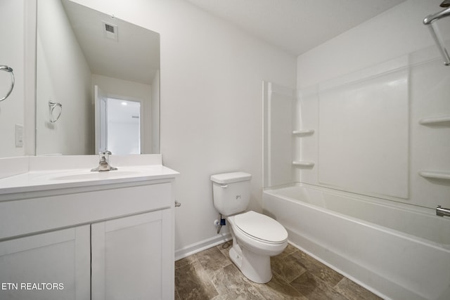 full bath featuring baseboards, visible vents, toilet, vanity, and shower / washtub combination