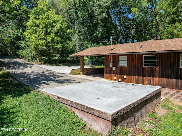 view of patio with an attached carport and concrete driveway