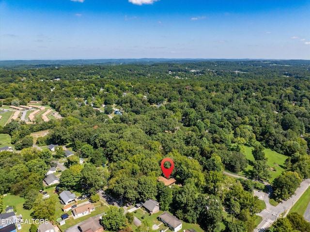 aerial view featuring a view of trees