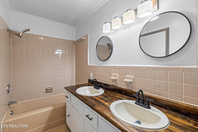 full bathroom featuring crown molding, a sink, and shower / tub combination