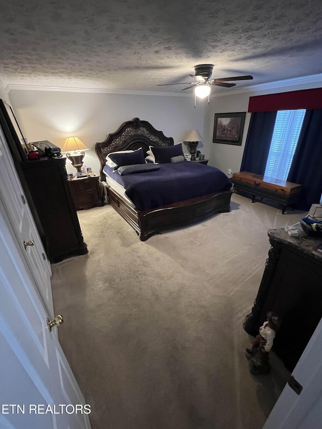 carpeted bedroom featuring a textured ceiling, a ceiling fan, and crown molding