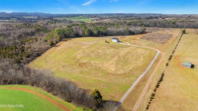 birds eye view of property with a rural view