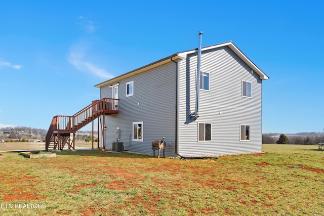 back of property featuring cooling unit, stairway, a lawn, and a wooden deck