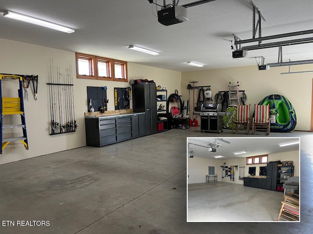 garage with a workshop area and a garage door opener