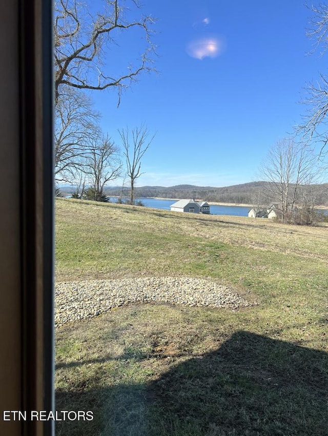 view of yard with a water view