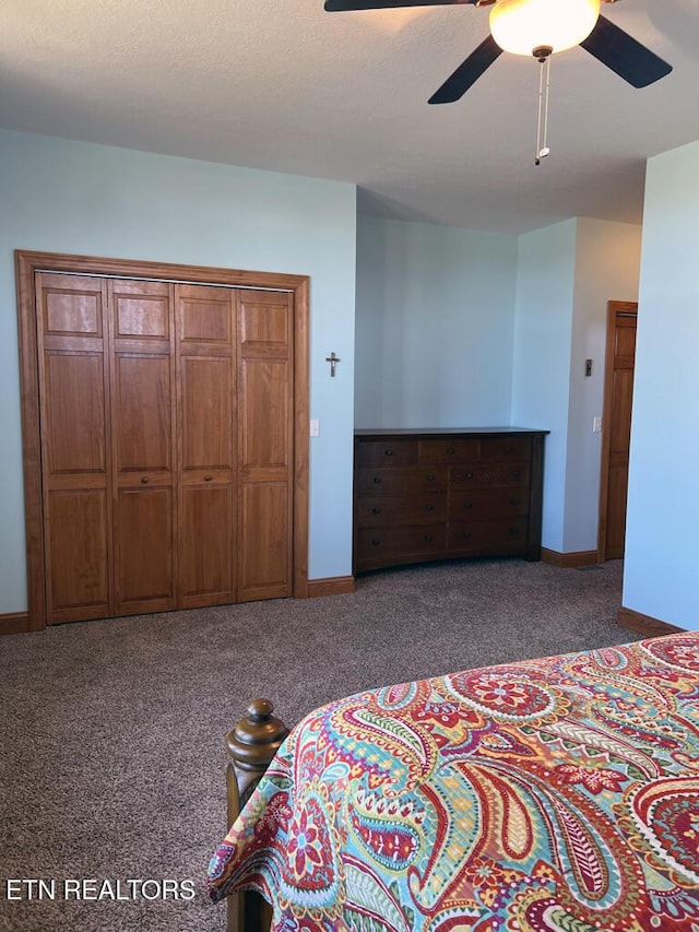 carpeted bedroom with a ceiling fan, a textured ceiling, and baseboards