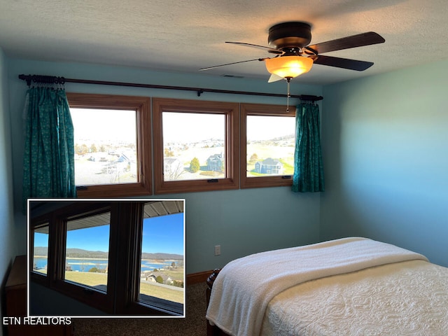 bedroom featuring a textured ceiling, ceiling fan, and visible vents