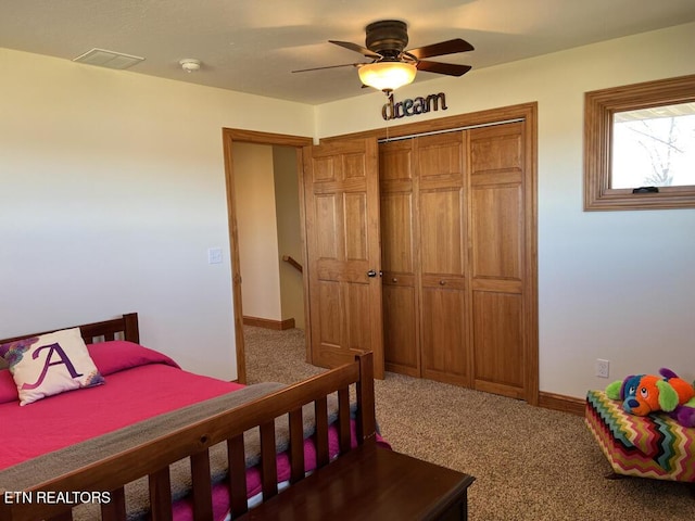 carpeted bedroom featuring a closet, a ceiling fan, and baseboards