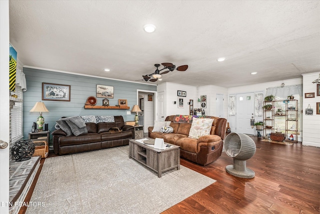 living area featuring ceiling fan, a textured ceiling, wood finished floors, and recessed lighting