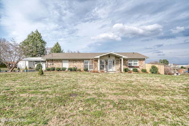 ranch-style house with fence and a front yard