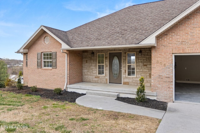 view of front facade featuring a porch, stone siding, roof with shingles, and brick siding