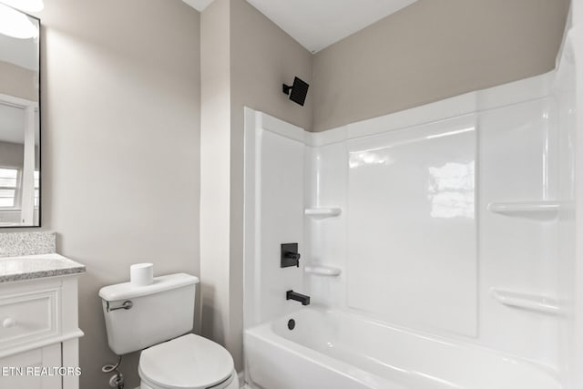 bathroom featuring shower / tub combination, vanity, and toilet