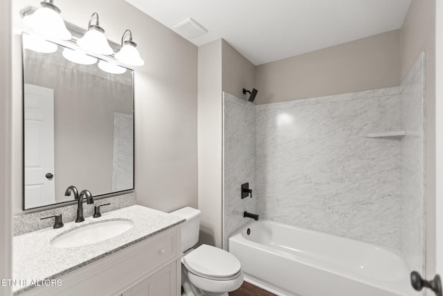 full bathroom with visible vents, shower / bathing tub combination, vanity, and toilet