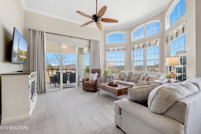 sunroom / solarium featuring ceiling fan and a healthy amount of sunlight