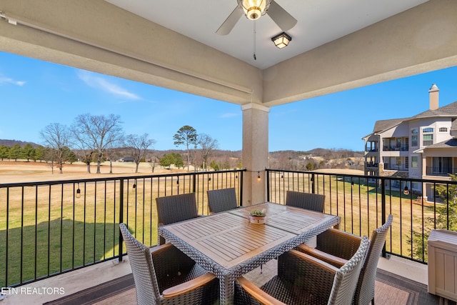 balcony featuring a ceiling fan