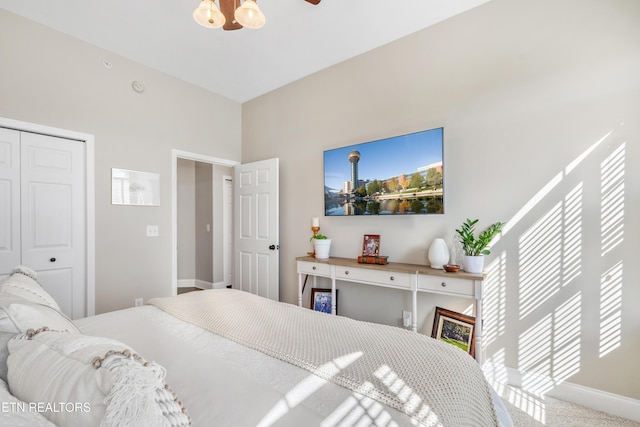 bedroom featuring a closet, carpet, and baseboards