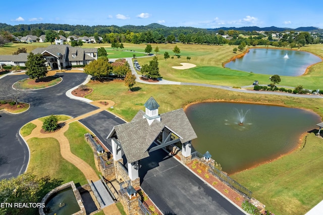 aerial view with a water view and golf course view