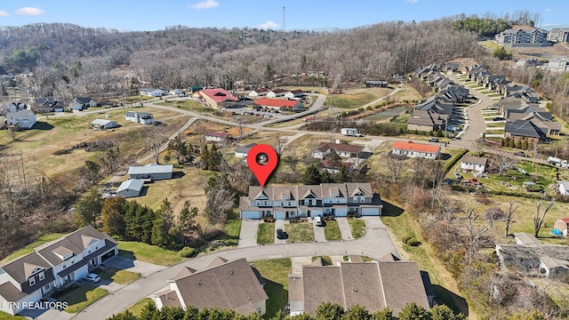 aerial view featuring a residential view and a view of trees