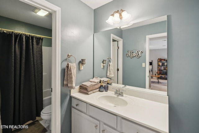 bathroom with toilet, shower / bath combo, and vanity