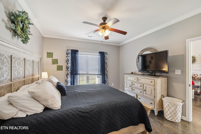 bedroom with visible vents, baseboards, dark wood-style flooring, ceiling fan, and ornamental molding