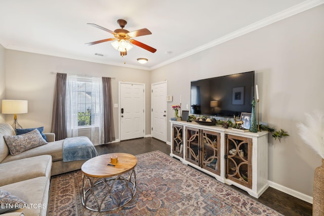 living room with visible vents, baseboards, ceiling fan, ornamental molding, and dark wood-type flooring