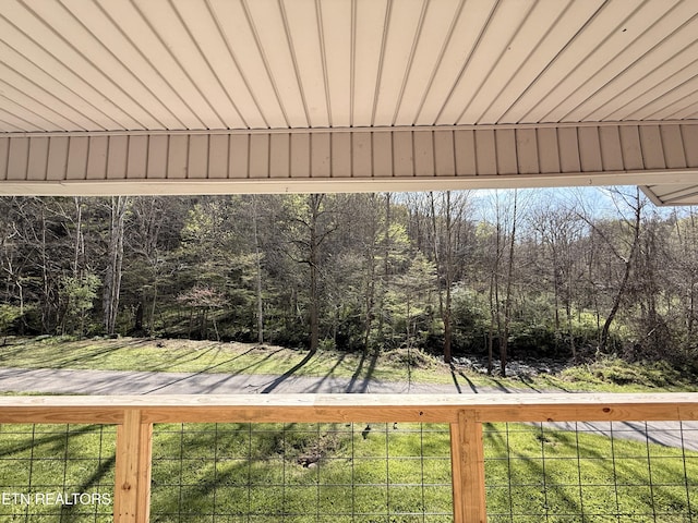 wooden deck featuring a yard
