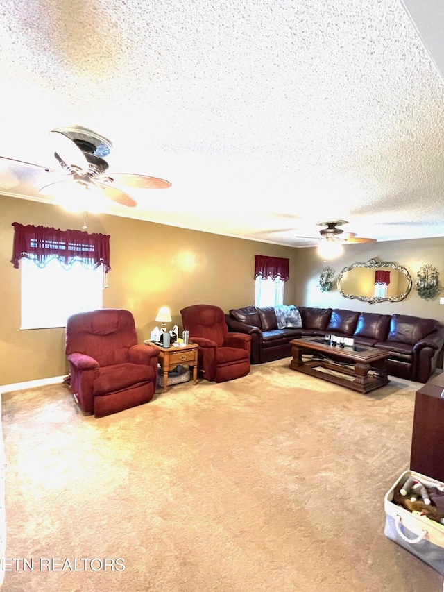 carpeted living area featuring a ceiling fan and a textured ceiling