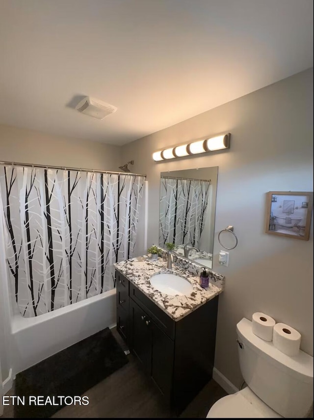 full bathroom with toilet, shower / tub combo, visible vents, and vanity