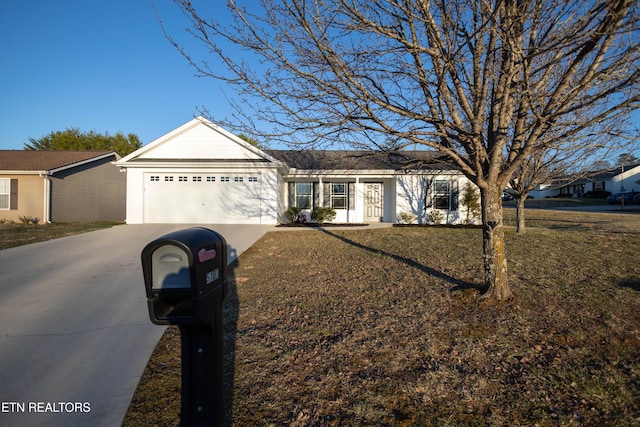 single story home featuring driveway and an attached garage