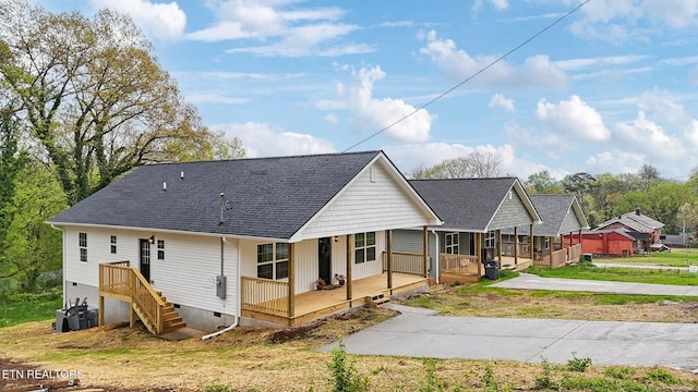 view of front of house with a porch, a shingled roof, and crawl space