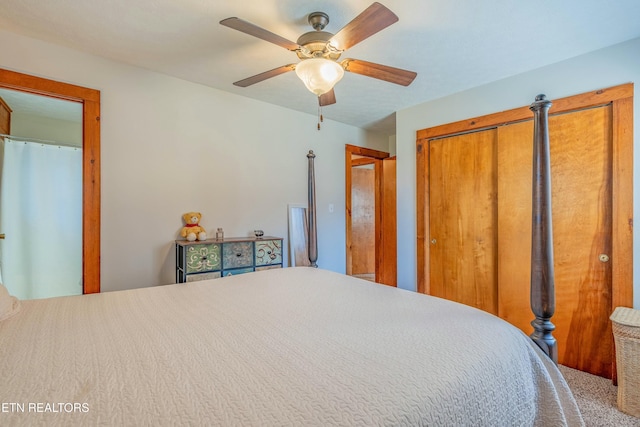 bedroom with ceiling fan and multiple closets