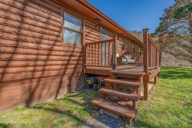 deck featuring a lawn