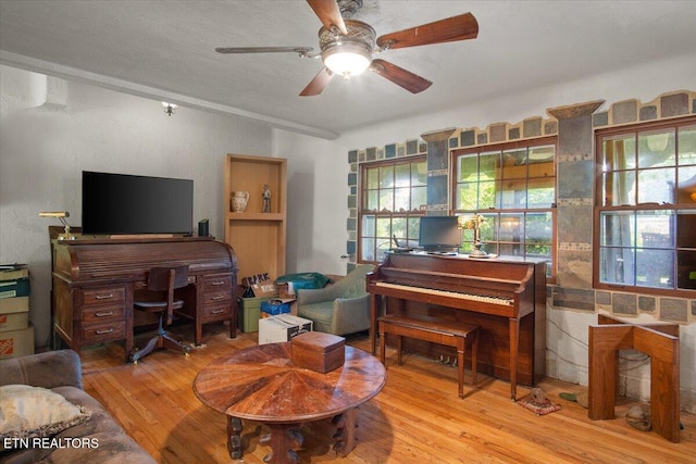 interior space with hardwood / wood-style flooring and a ceiling fan