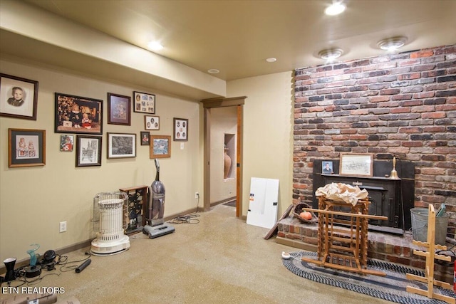 interior space featuring recessed lighting, a wood stove, and baseboards