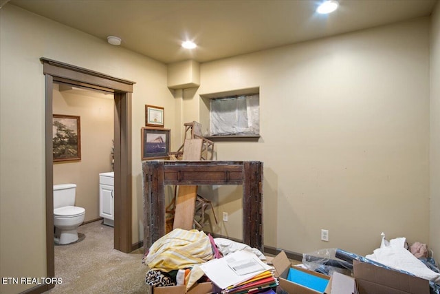 half bathroom with recessed lighting and toilet