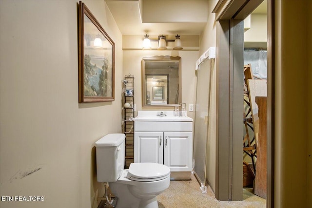 half bath with vanity and toilet