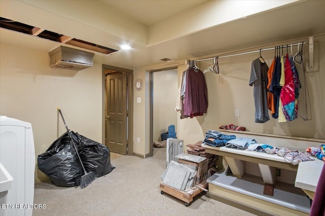 interior space with washer / dryer, carpet, and visible vents