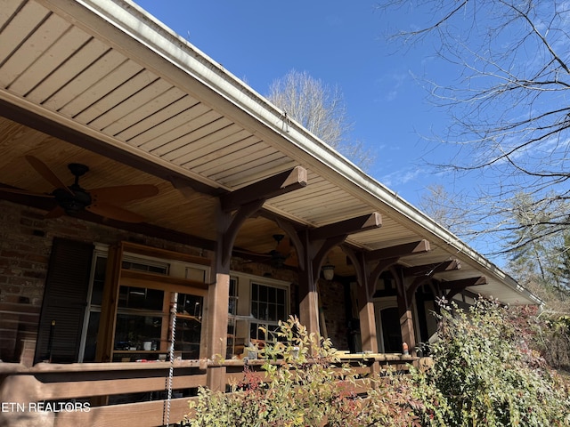 exterior space with ceiling fan