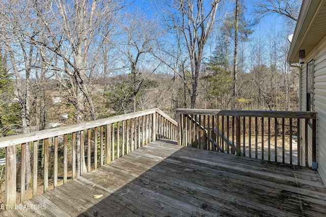 wooden terrace with a forest view