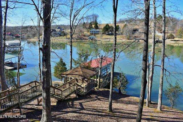 exterior space featuring a water view and a gazebo