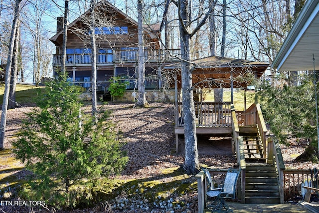 view of yard with stairs and a wooden deck