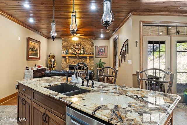 kitchen featuring a fireplace, crown molding, stainless steel dishwasher, wood ceiling, and a sink