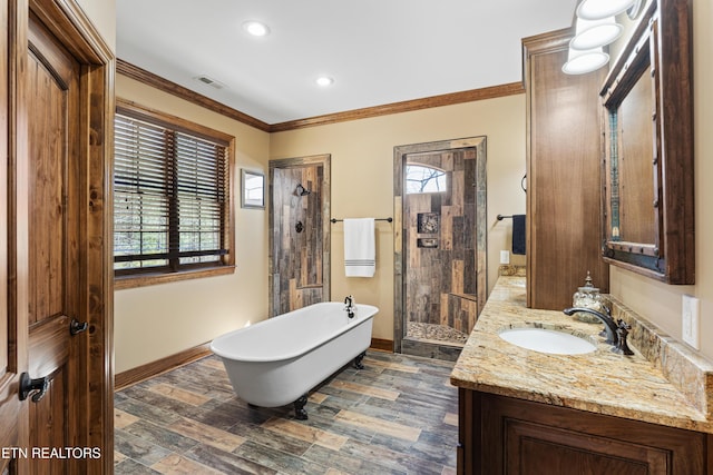 bathroom with vanity, baseboards, visible vents, walk in shower, and crown molding