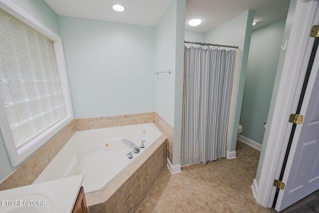 full bathroom with toilet, a jetted tub, a shower with shower curtain, and vanity