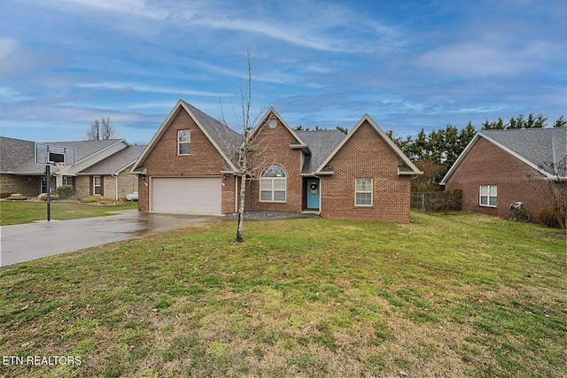 traditional-style home featuring driveway, a garage, brick siding, fence, and a front yard