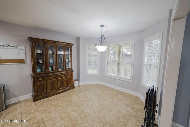 dining space featuring baseboards