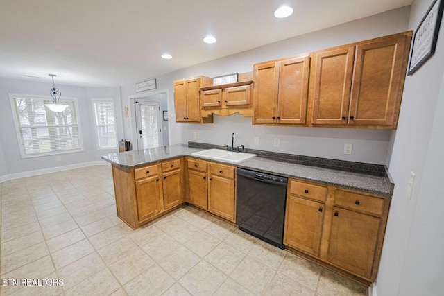 kitchen featuring black dishwasher, dark countertops, a peninsula, a sink, and recessed lighting