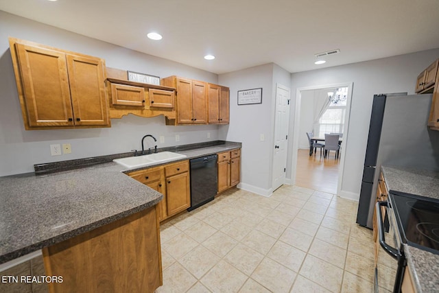 kitchen with dark countertops, recessed lighting, visible vents, a sink, and black appliances