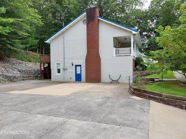 view of side of home with a chimney