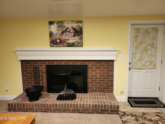 room details featuring a fireplace and baseboards